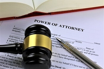 Power of attorney document with pen and gavel