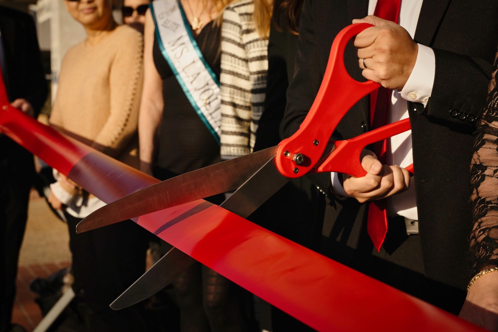 Scissors cutting ribbon | San Diego estate planning attorney