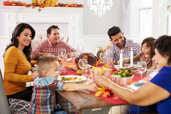 family at Thanksgiving table after creating an estate plan | La Mesa Estate Planning Lawyer