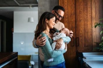 Couple holding a baby